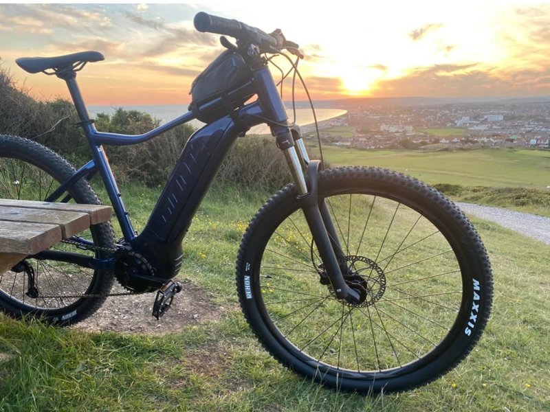 a bicycle parked in a grassy field