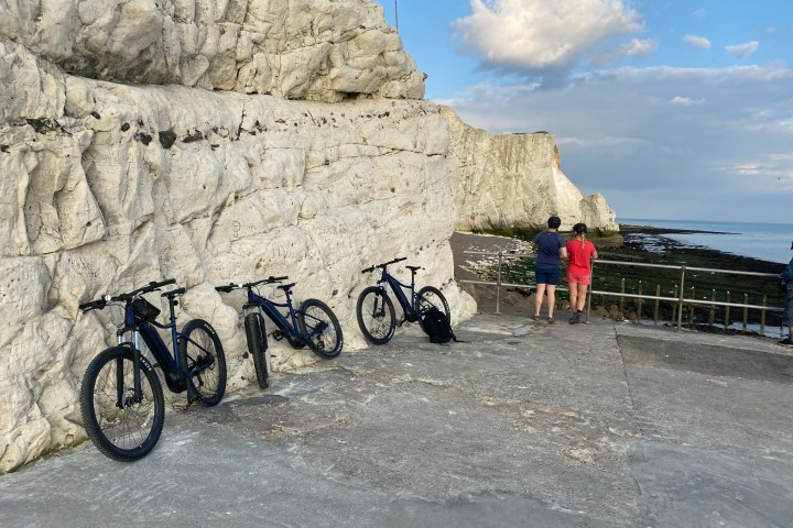 a group of people standing by e-bikes