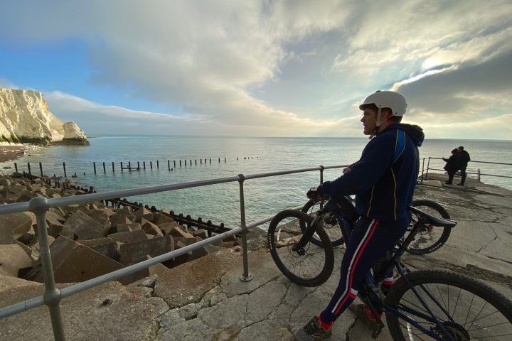 a person standing next to a bicycle