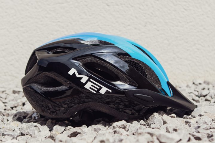 a pair of blue shoes with a helmet on