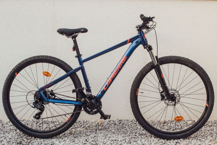 a bicycle parked on a sidewalk
