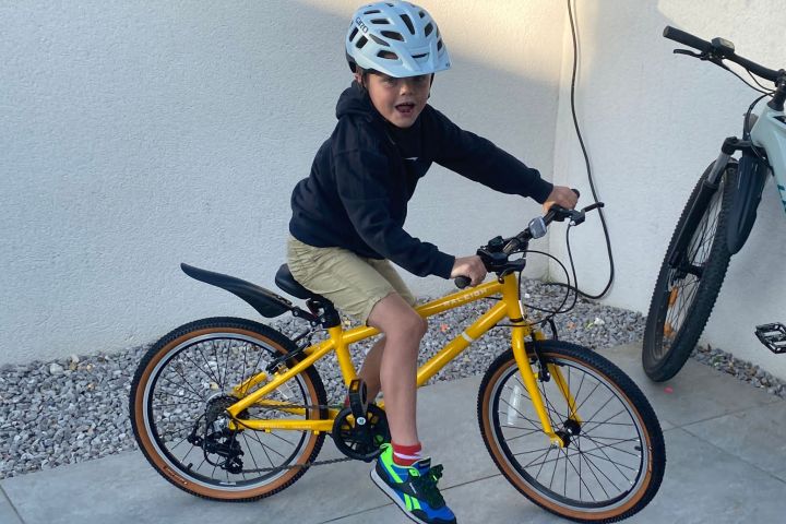a young boy riding a bicycle