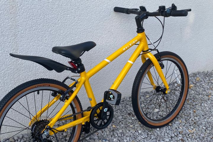 a bicycle parked on the side of the road