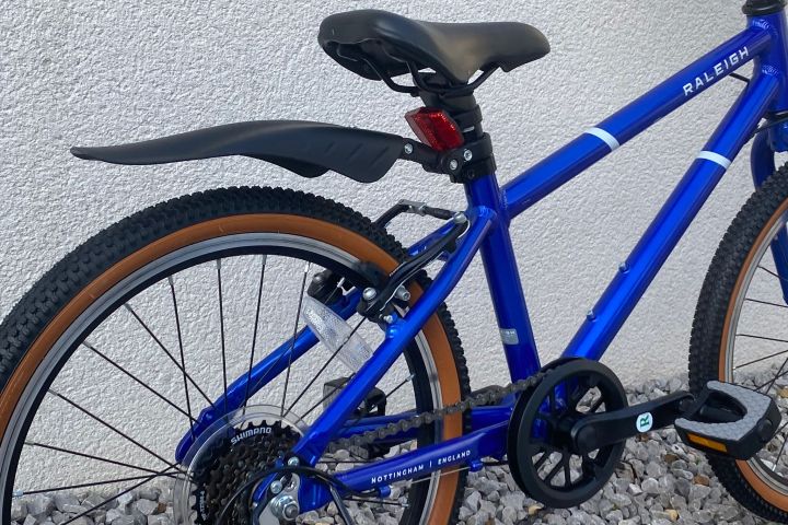 a bicycle parked on the side of the road
